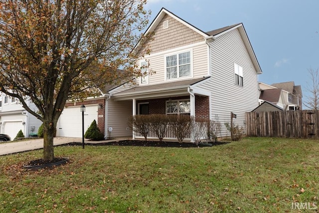 front of property with a front yard and a garage