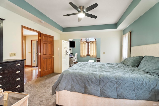 bedroom with light carpet and ceiling fan