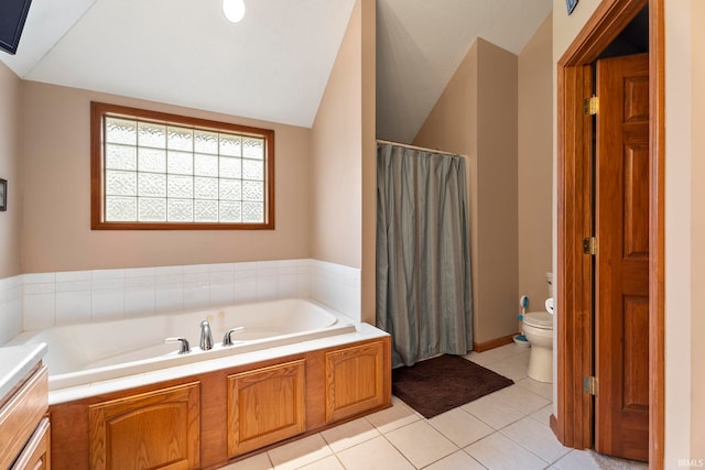 bathroom with a bathtub, tile patterned flooring, lofted ceiling, and toilet