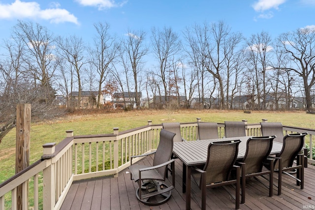 wooden deck featuring a yard