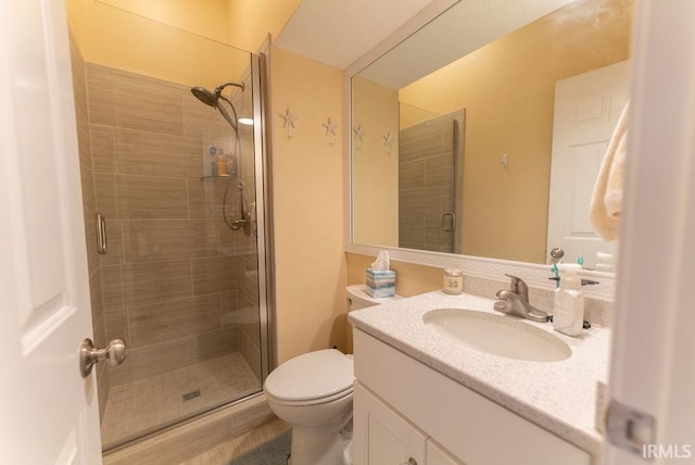 bathroom featuring hardwood / wood-style flooring, a shower with door, vanity, and toilet