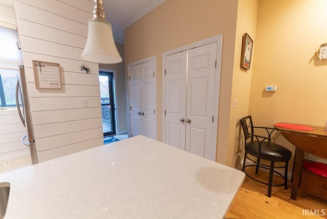 bedroom featuring wood-type flooring and crown molding