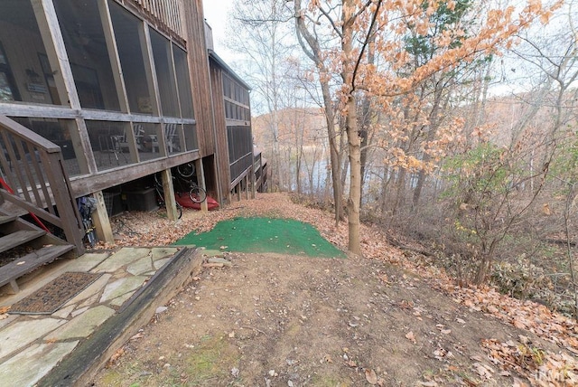 view of yard with a sunroom