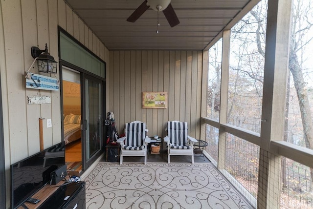 sunroom / solarium with plenty of natural light and ceiling fan