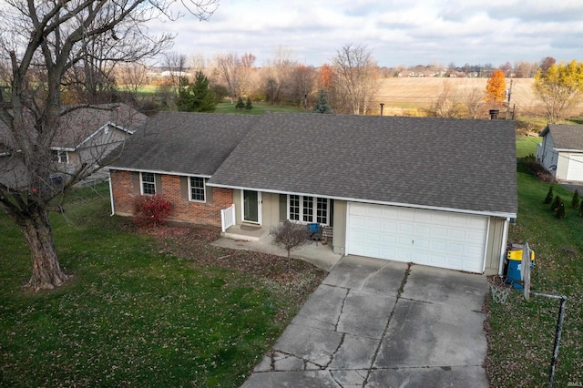 single story home featuring a garage and a front lawn