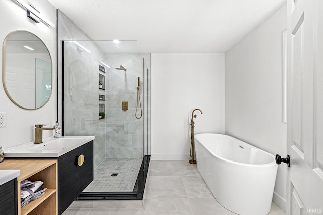 bathroom featuring vanity and shower with separate bathtub