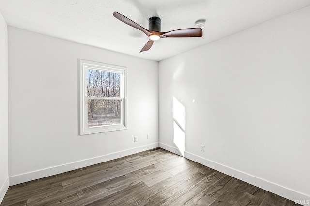 empty room featuring hardwood / wood-style floors and ceiling fan