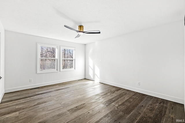 spare room with wood-type flooring, a textured ceiling, and ceiling fan