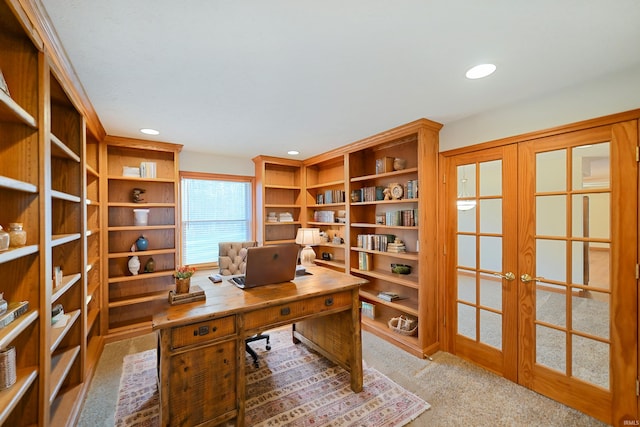 carpeted office featuring french doors