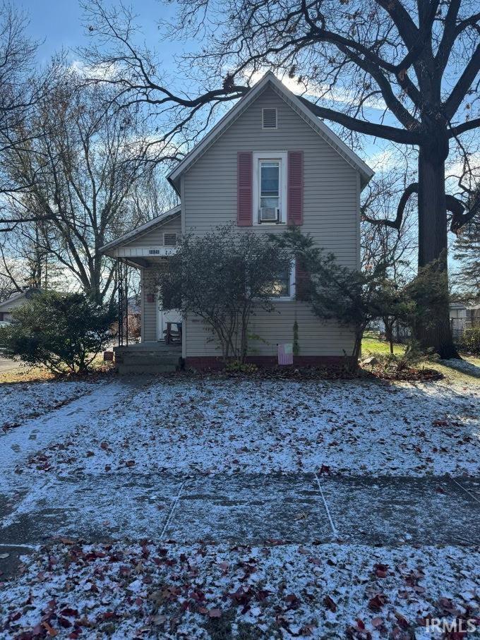 snow covered property featuring cooling unit