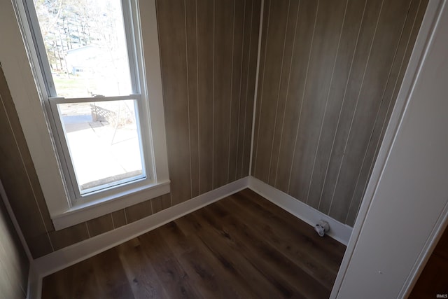room details with wood walls and wood-type flooring