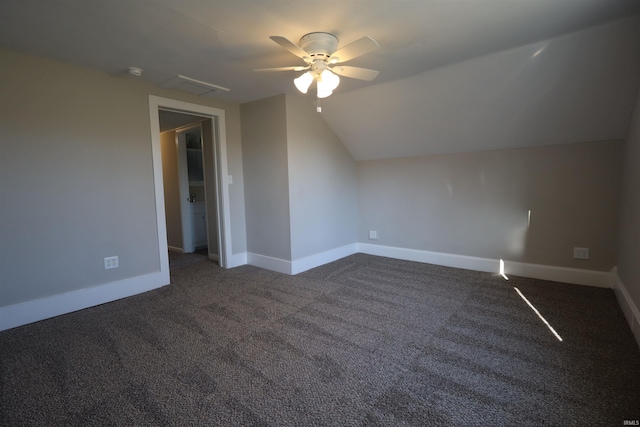 bonus room featuring dark carpet, ceiling fan, and lofted ceiling
