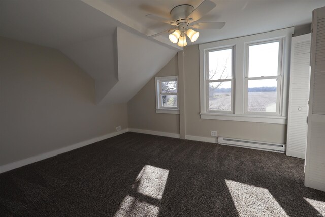 bonus room with dark colored carpet, ceiling fan, vaulted ceiling, and a baseboard radiator