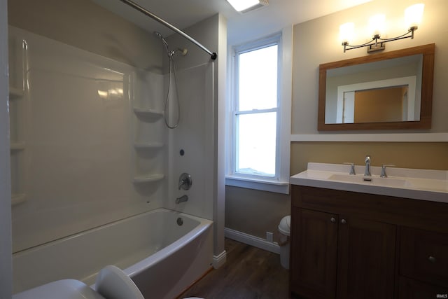 full bathroom featuring shower / bath combination, toilet, a healthy amount of sunlight, and hardwood / wood-style flooring