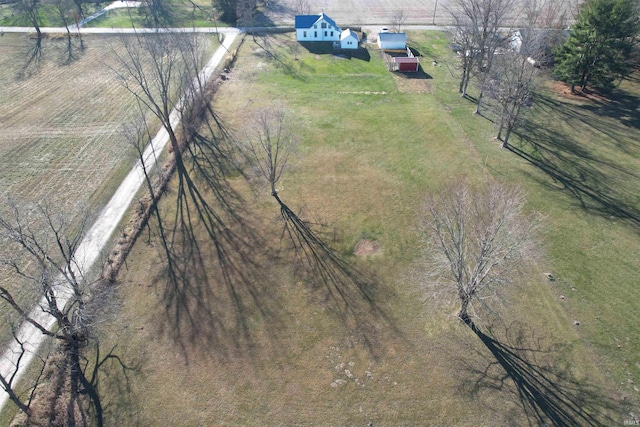 birds eye view of property with a rural view