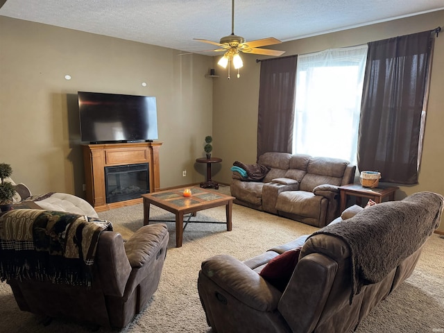 3020 10 Oclock Rd, Bloomingdale, IN 47832 - living room featuring light carpet, ceiling fan, a textured ceiling, and a glass covered fireplace