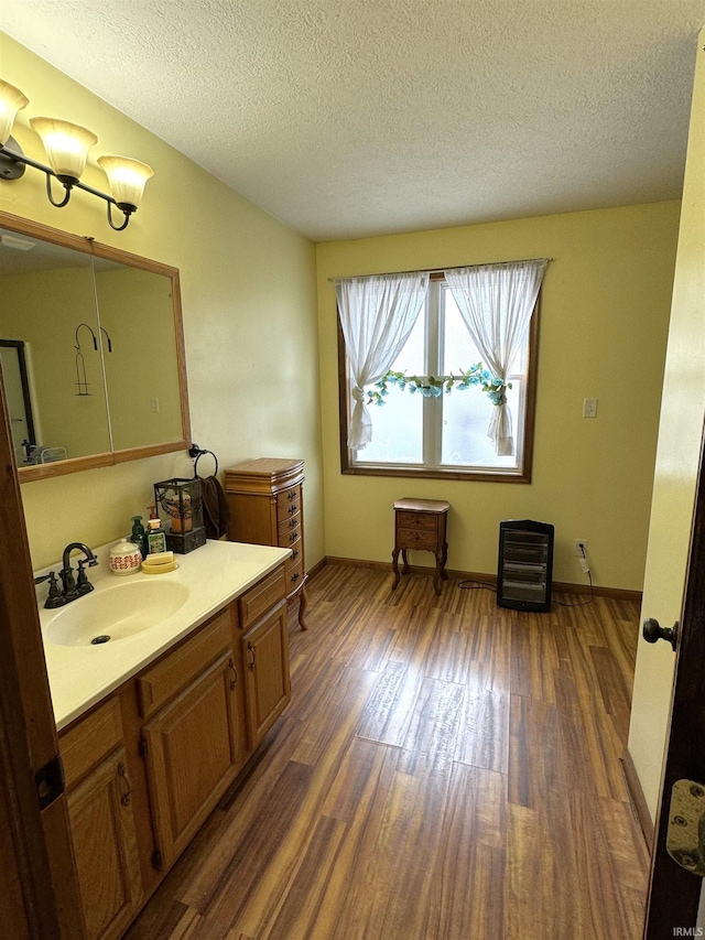 3020 10 Oclock Rd, Bloomingdale, IN 47832 - bathroom featuring wood finished floors, vanity, a textured ceiling, and baseboards
