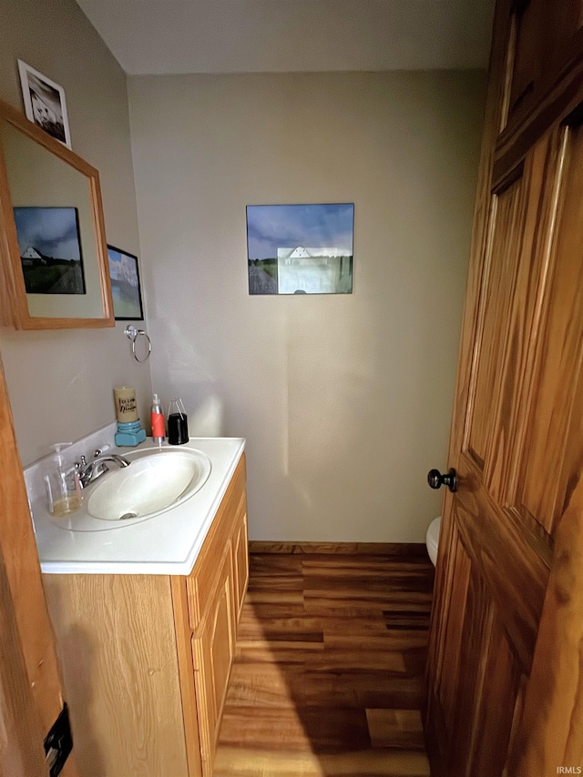 3020 10 Oclock Rd, Bloomingdale, IN 47832 - bathroom featuring vanity, wood finished floors, toilet, and baseboards