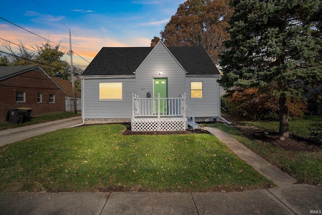 view of front of house with a yard