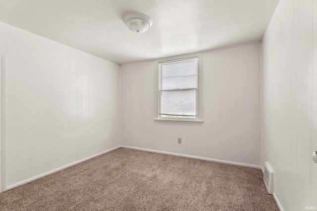 spare room featuring carpet flooring