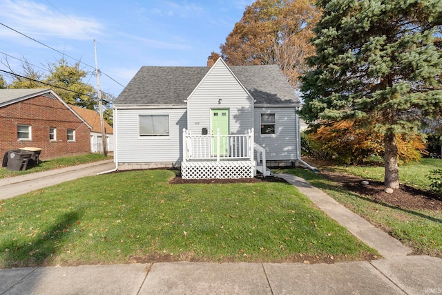 bungalow-style house with a front lawn