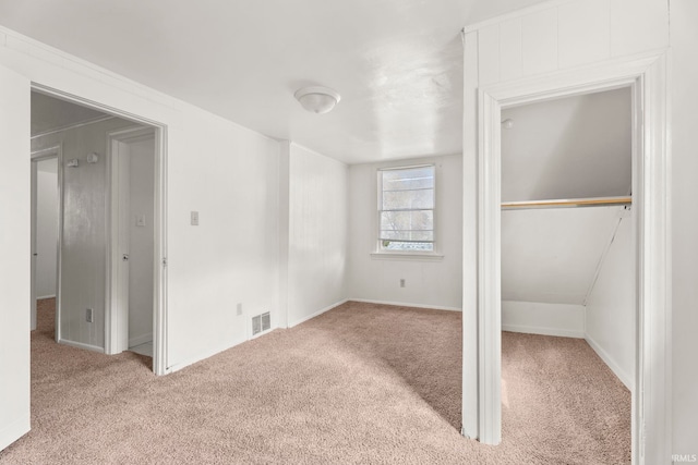 unfurnished bedroom featuring light colored carpet