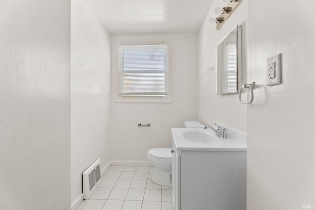 bathroom featuring tile patterned flooring, vanity, and toilet