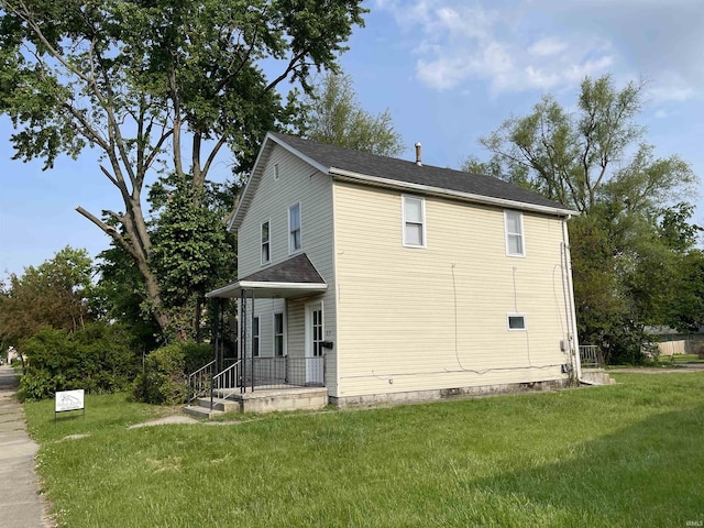 view of home's exterior with a lawn