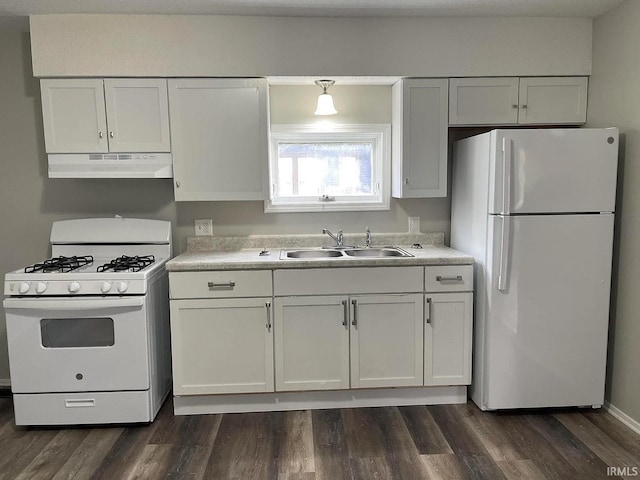 kitchen with white cabinets, white appliances, sink, and dark wood-type flooring