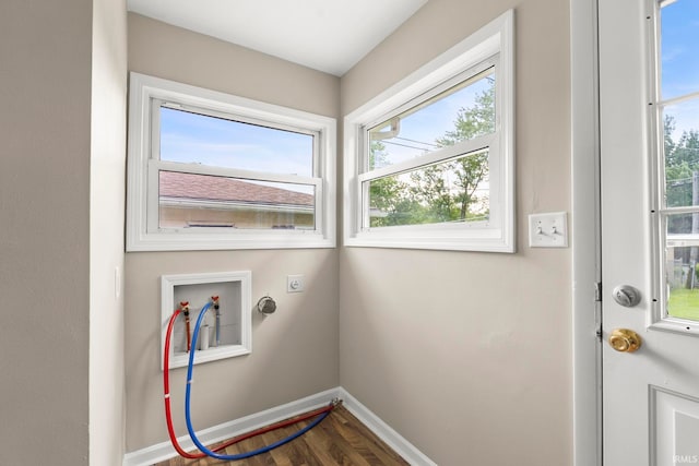 washroom with hookup for an electric dryer, wood-type flooring, and hookup for a washing machine