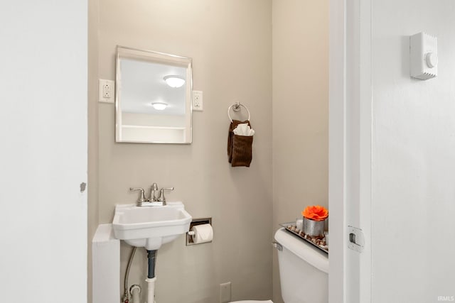 bathroom with toilet and sink