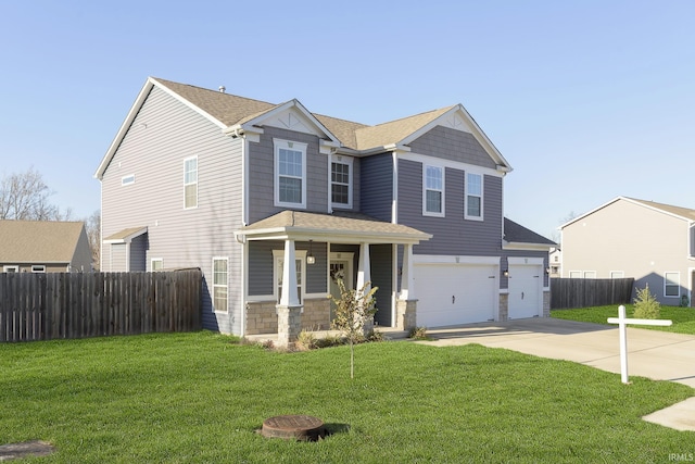 view of front of home with a porch, a garage, and a front lawn