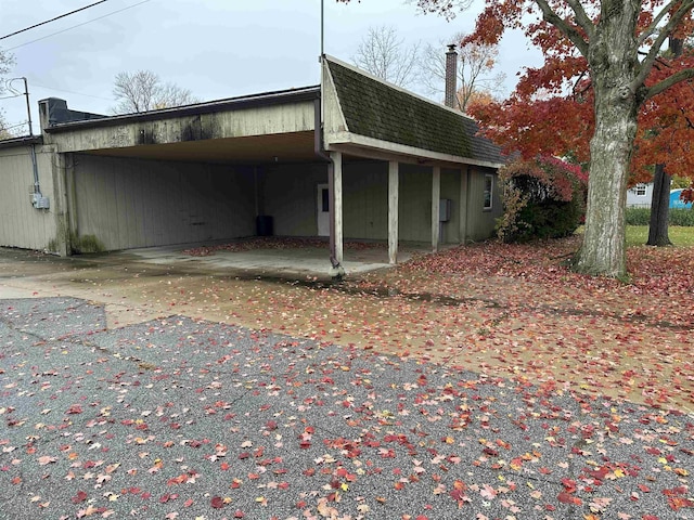 view of home's exterior featuring a carport