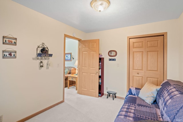 living room featuring light colored carpet and a textured ceiling