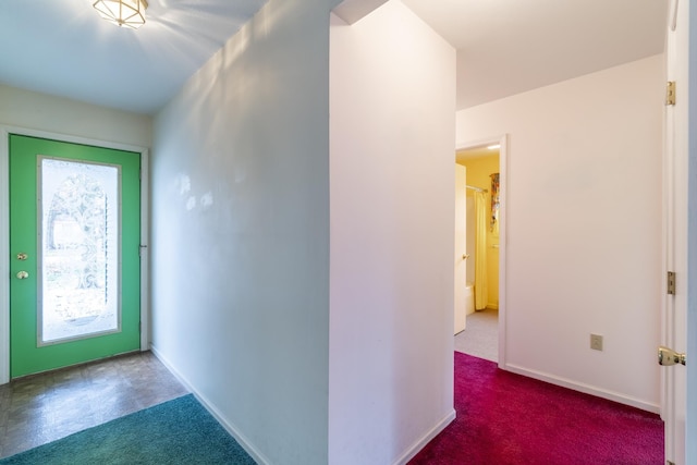 view of carpeted entrance foyer