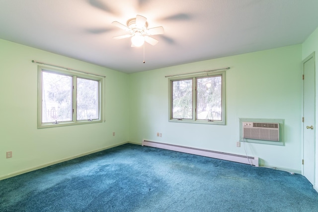 spare room with a wall mounted AC, ceiling fan, plenty of natural light, and a baseboard heating unit