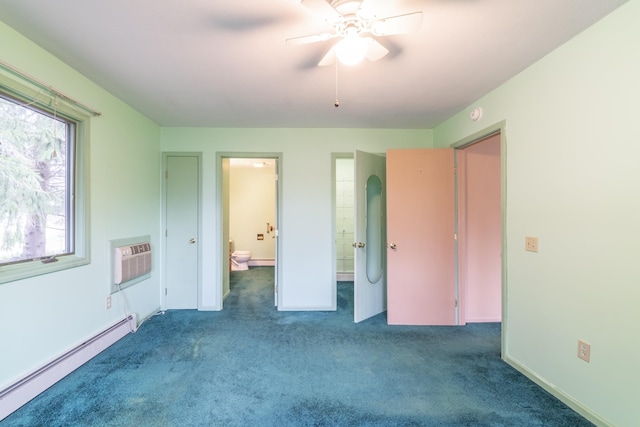 unfurnished bedroom with a wall mounted air conditioner, ensuite bath, ceiling fan, dark colored carpet, and a baseboard radiator