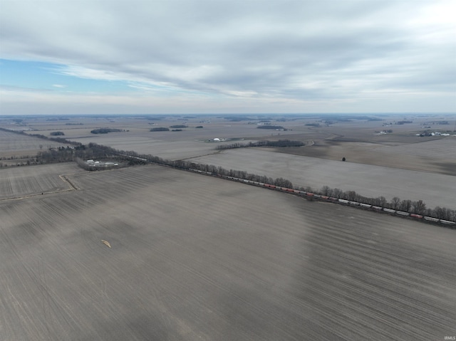 birds eye view of property with a rural view