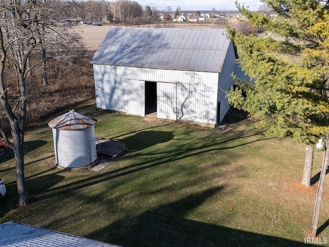 view of outbuilding featuring a lawn