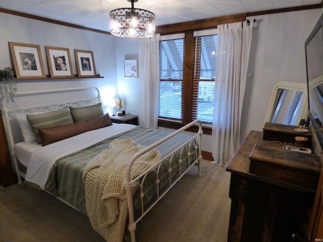 bedroom featuring ornamental molding and a notable chandelier