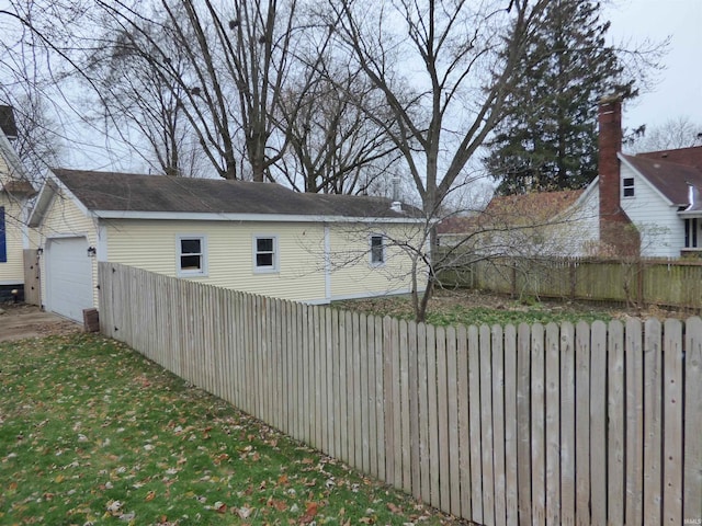 view of side of home featuring a garage