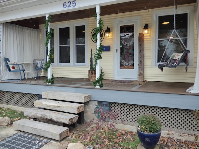 property entrance with covered porch