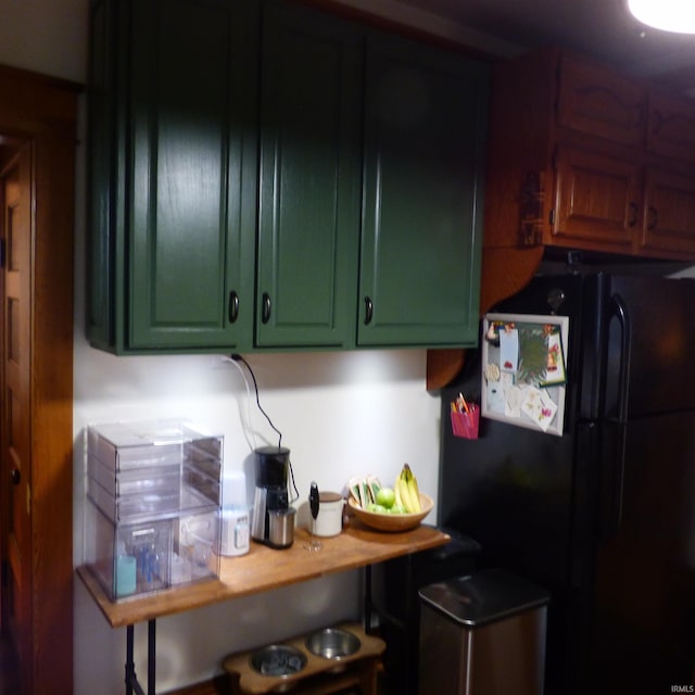 kitchen featuring black fridge