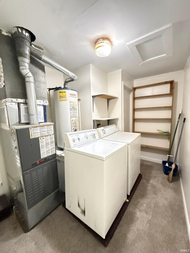 washroom with water heater, washer and clothes dryer, and carpet