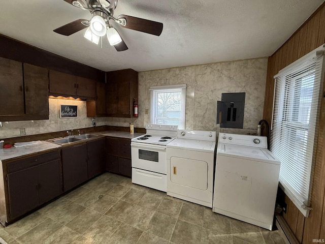 kitchen with dark brown cabinetry, washer and clothes dryer, sink, electric panel, and white range with electric cooktop