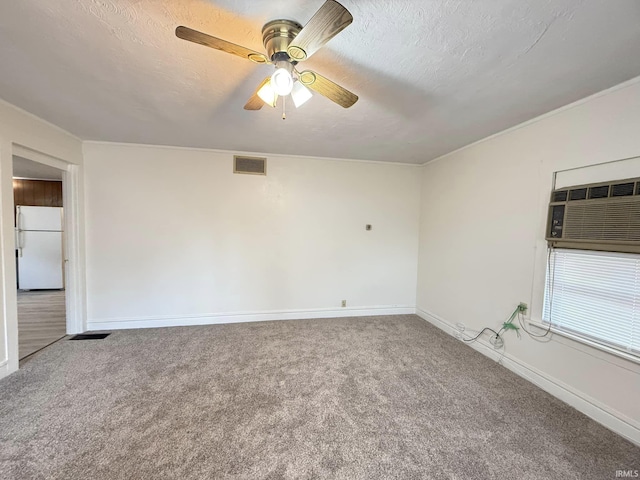 unfurnished room with ceiling fan, carpet floors, a textured ceiling, and a wall unit AC