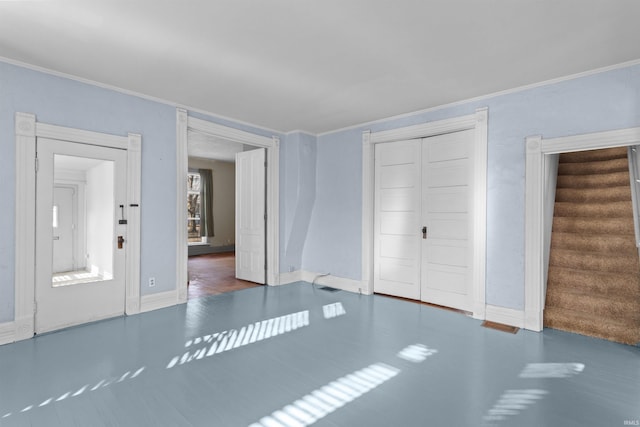 interior space featuring crown molding and a closet