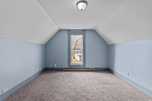 bonus room with carpet, lofted ceiling, baseboard heating, and a textured ceiling