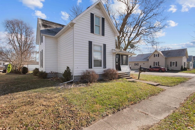 view of property exterior featuring a lawn