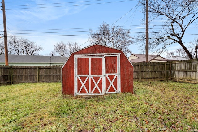 view of outbuilding featuring a yard